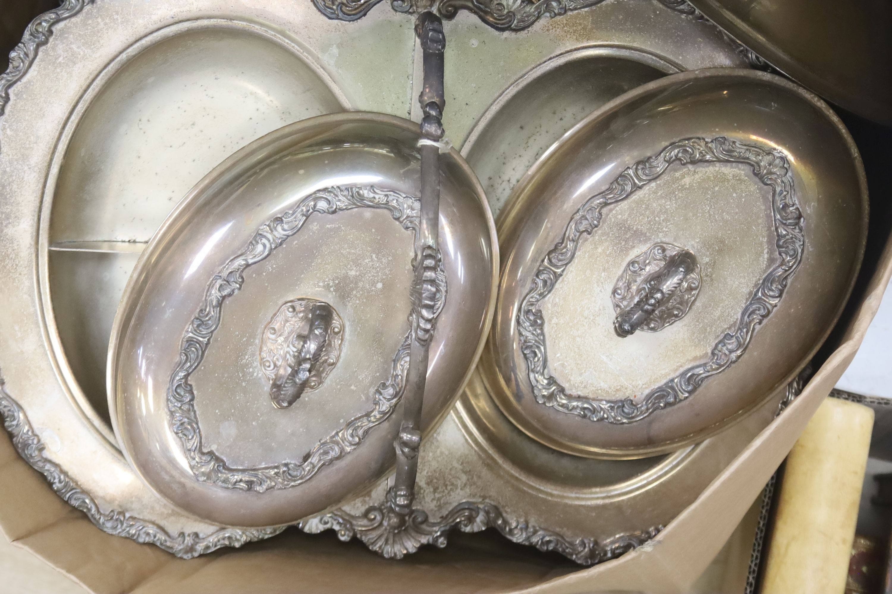 A quantity of plated wares to include tureens and covers, chargers etc.